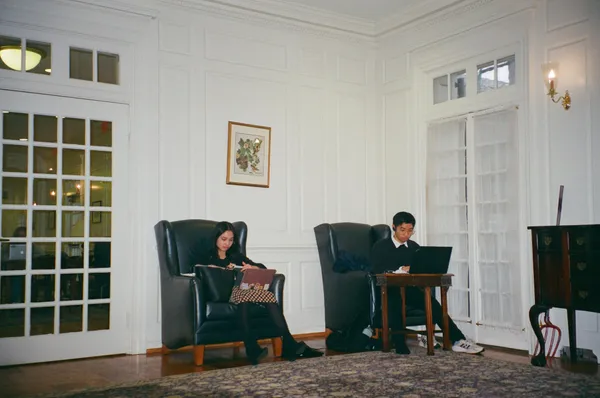 A friend and I studying in the common room of Pierson College at Yale. November 2022.